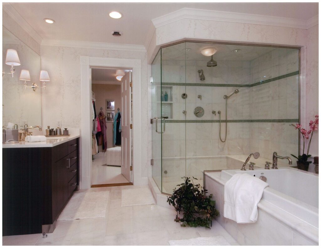 bathroom with large glass shower and bathtub